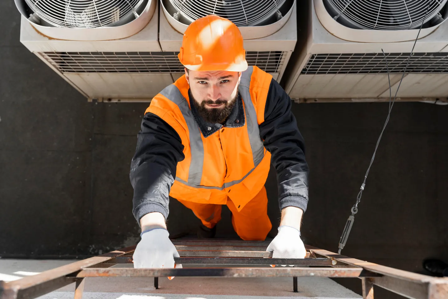 HVAC contractor website showing technician on rooftop AC unit